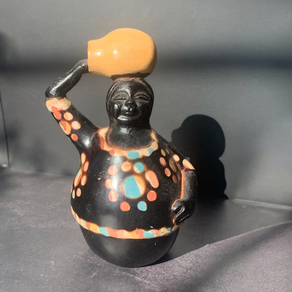 Chulucana pottery woman carrying pot