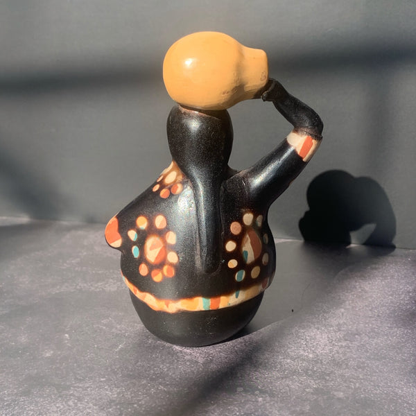 Chulucana pottery woman carrying pot